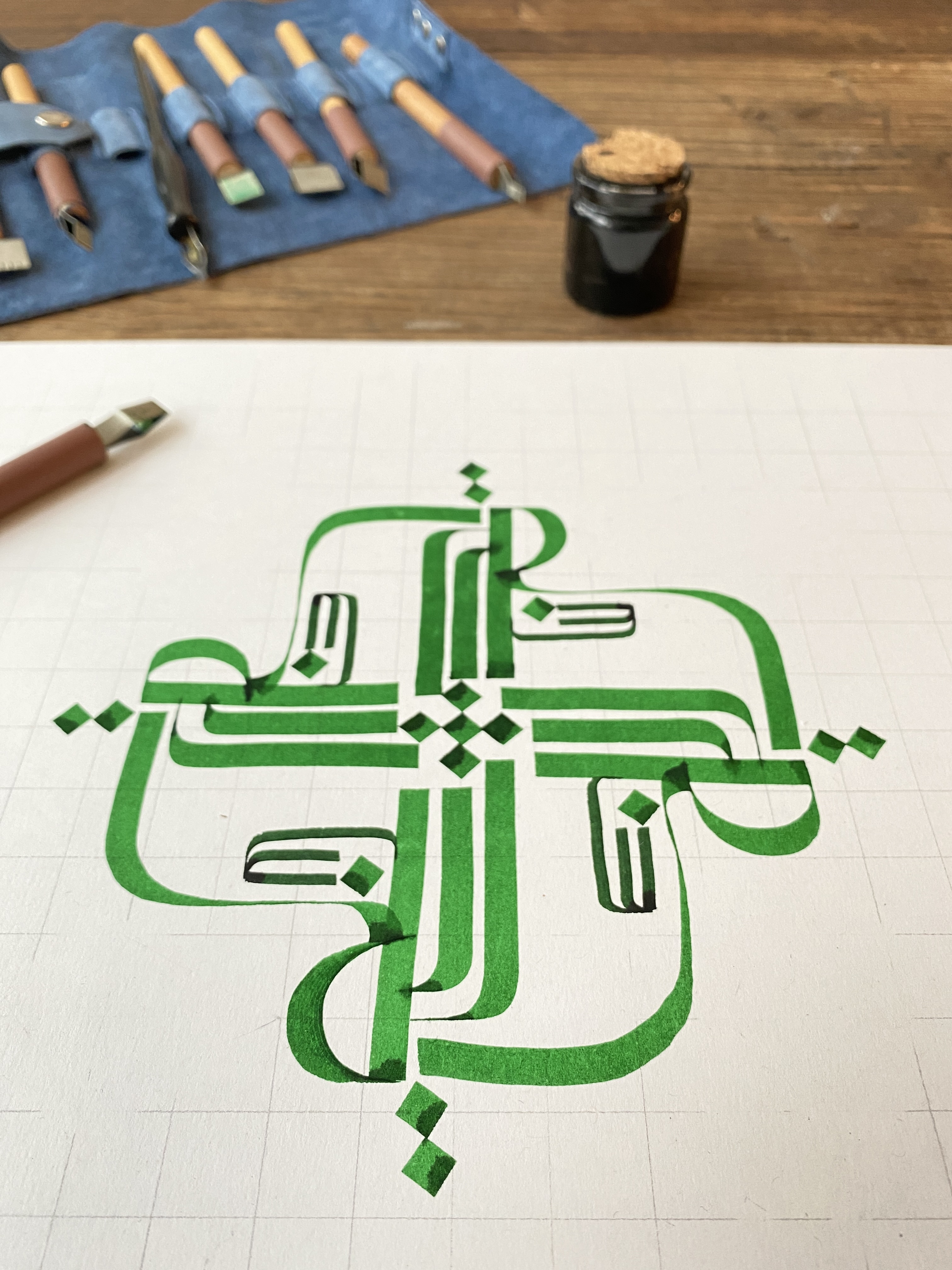 Allah Janan green square Kufic calligraphy